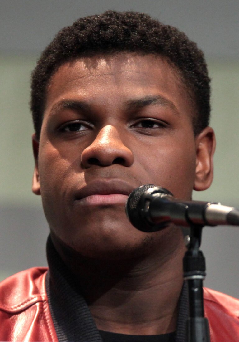 John Boyega smiling at a fan event