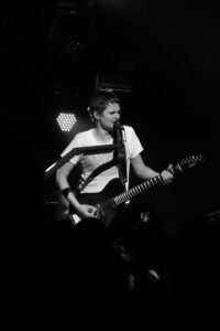 Muse frontman Matt Bellamy performing on stage